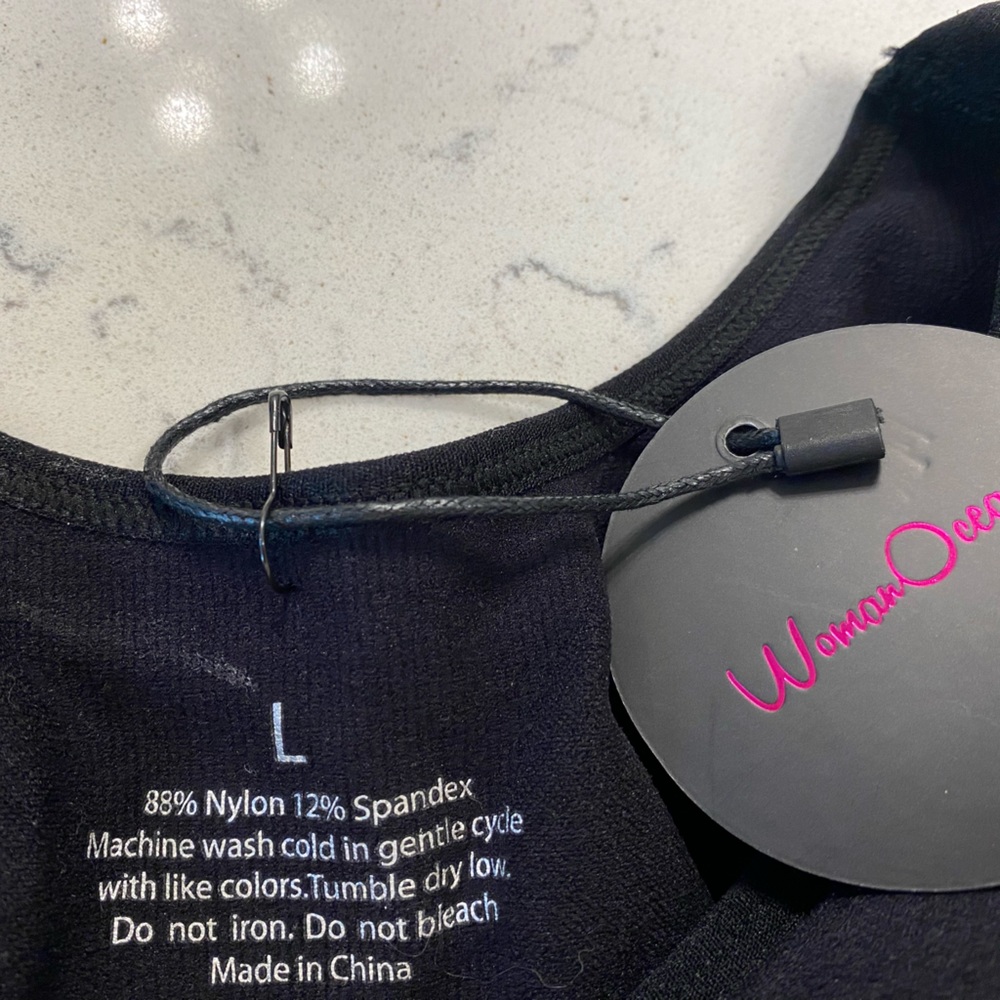 Black cami shape wear. Never worn.